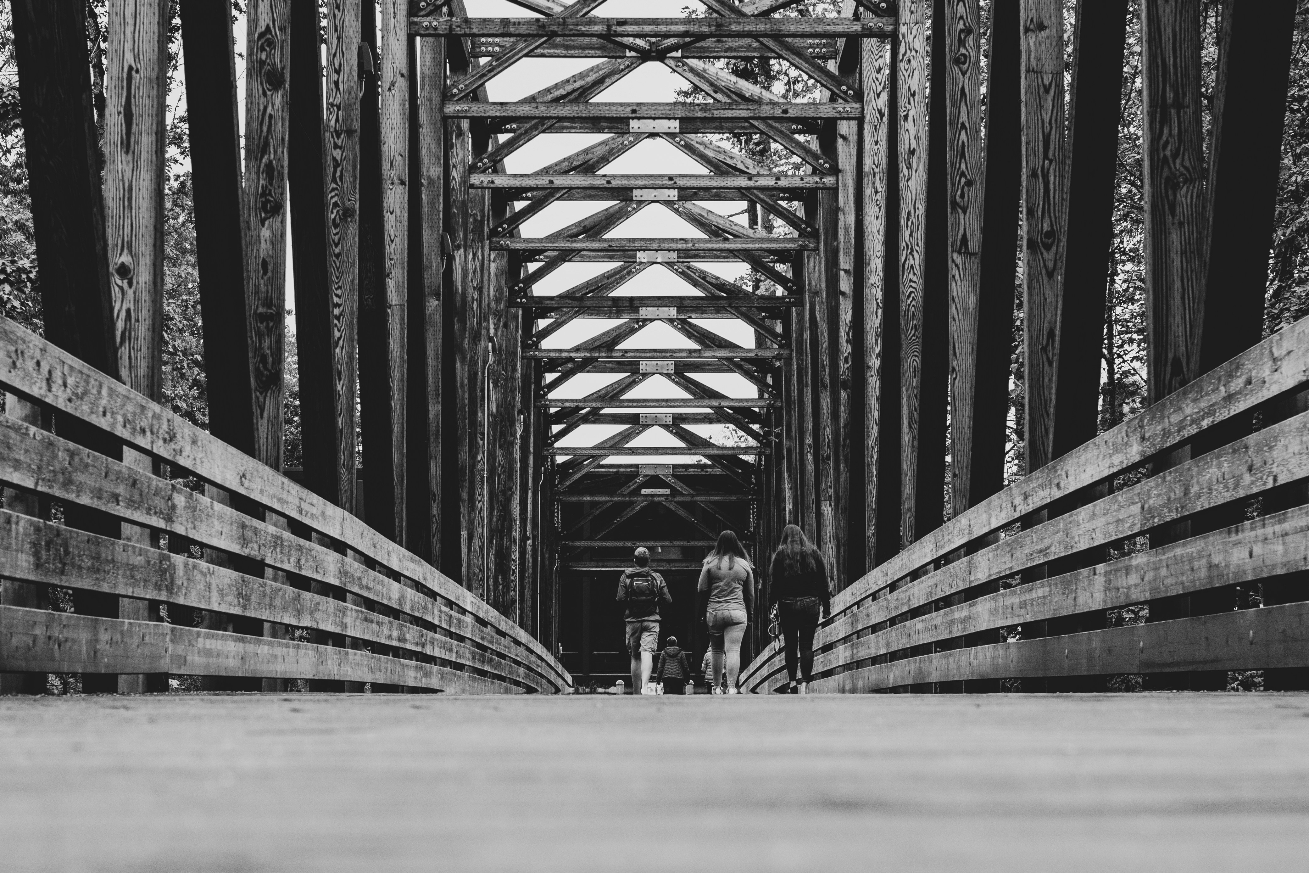Family walking on bridge