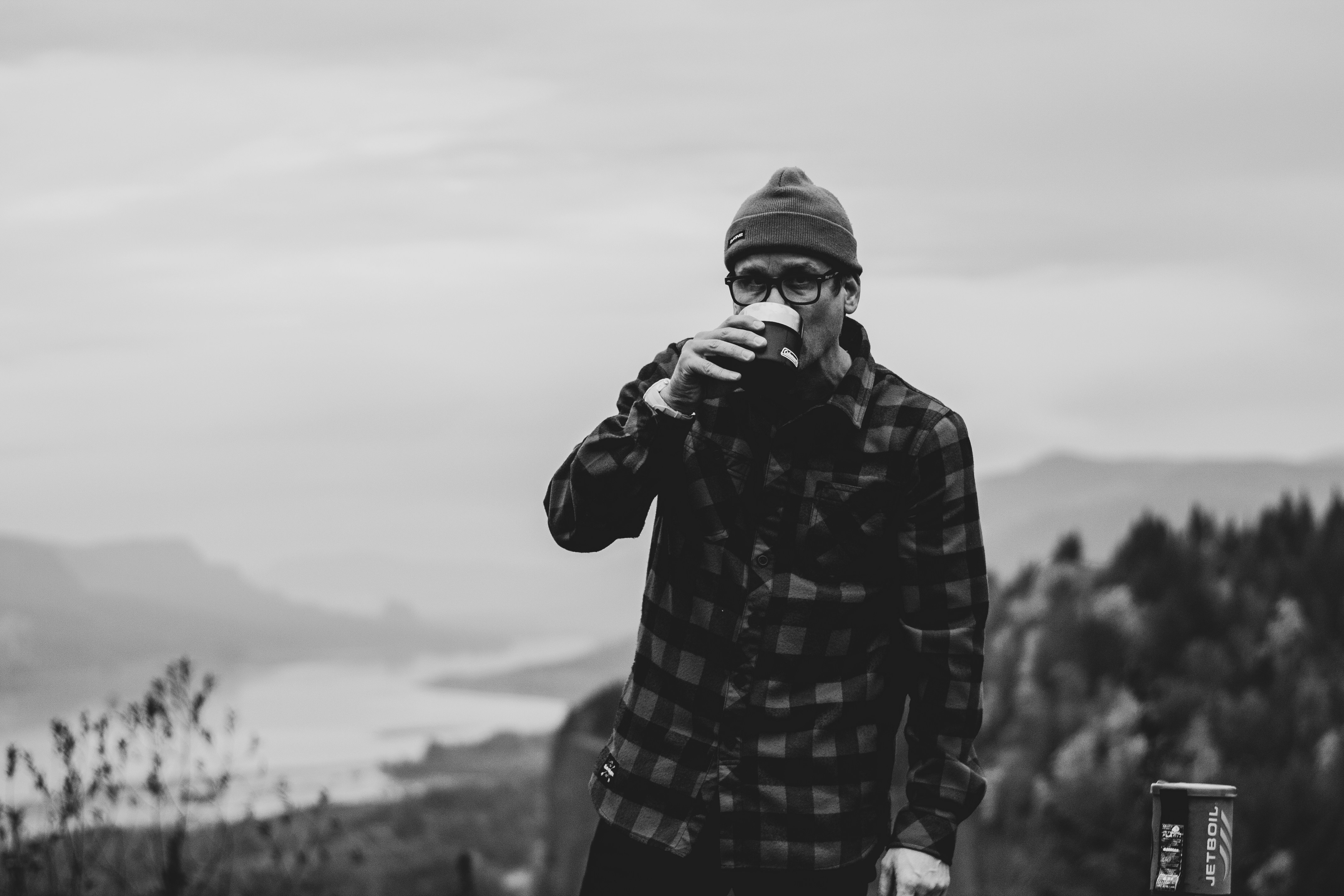 Man with coffee overlooking the gorge
